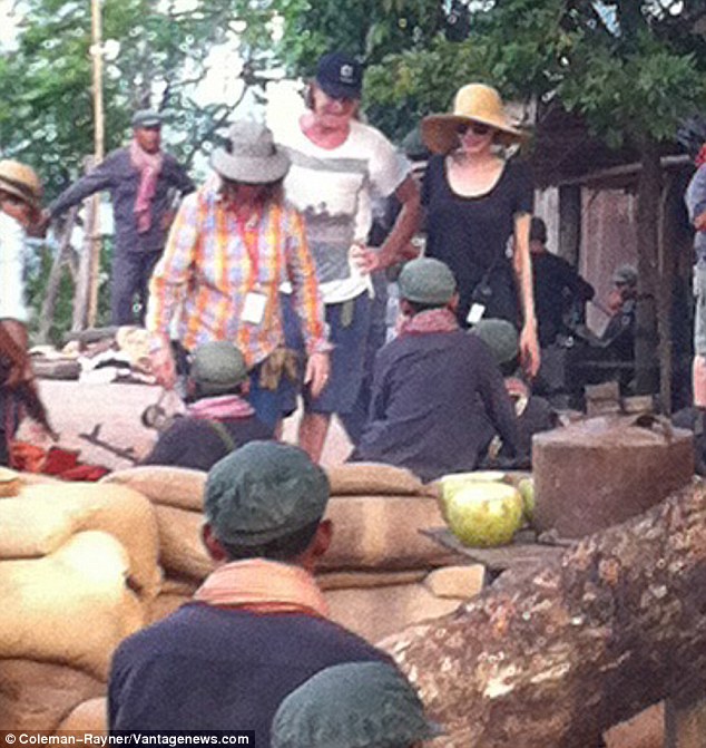 Doing her bit: She looked in great spirits with a smile on her face, days after arriving in the country